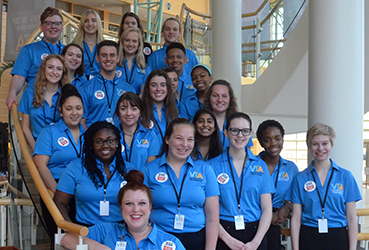 Group of Teen Ushers on the stairs in the Schuster Center Wintergarden