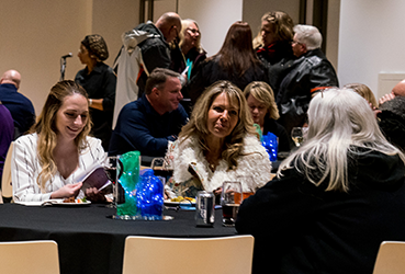 Teachers socializing at a Teacher's Lounge event
