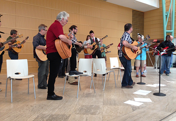 Guitar players in the Wintergarden at the Schuster Center