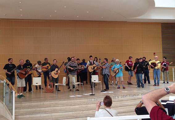 Guitar players perform on the steps in the Wintergarden at the Schuster Center