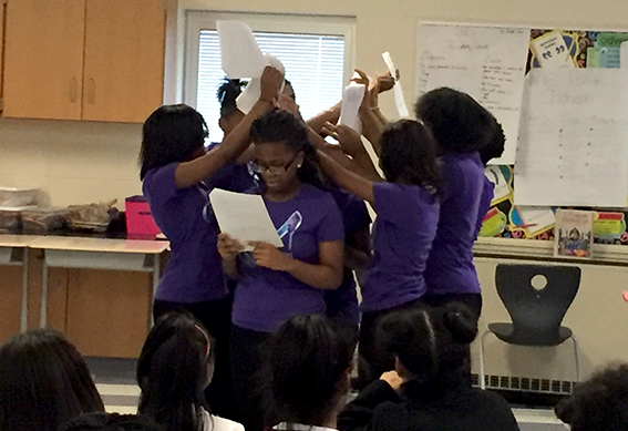 A group of girls perform at the Superhero Girls Like Me education project.