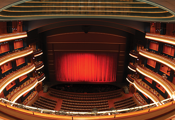 Mead Theatre stage with red curtain closed as seen from the center balcony